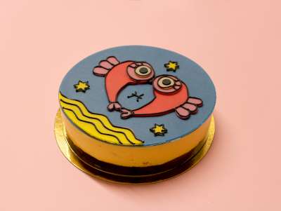 Gâteau d'anniversaire Astro Poisson avec un dessin de l'artiste française Virgen. À commander et personnaliser.