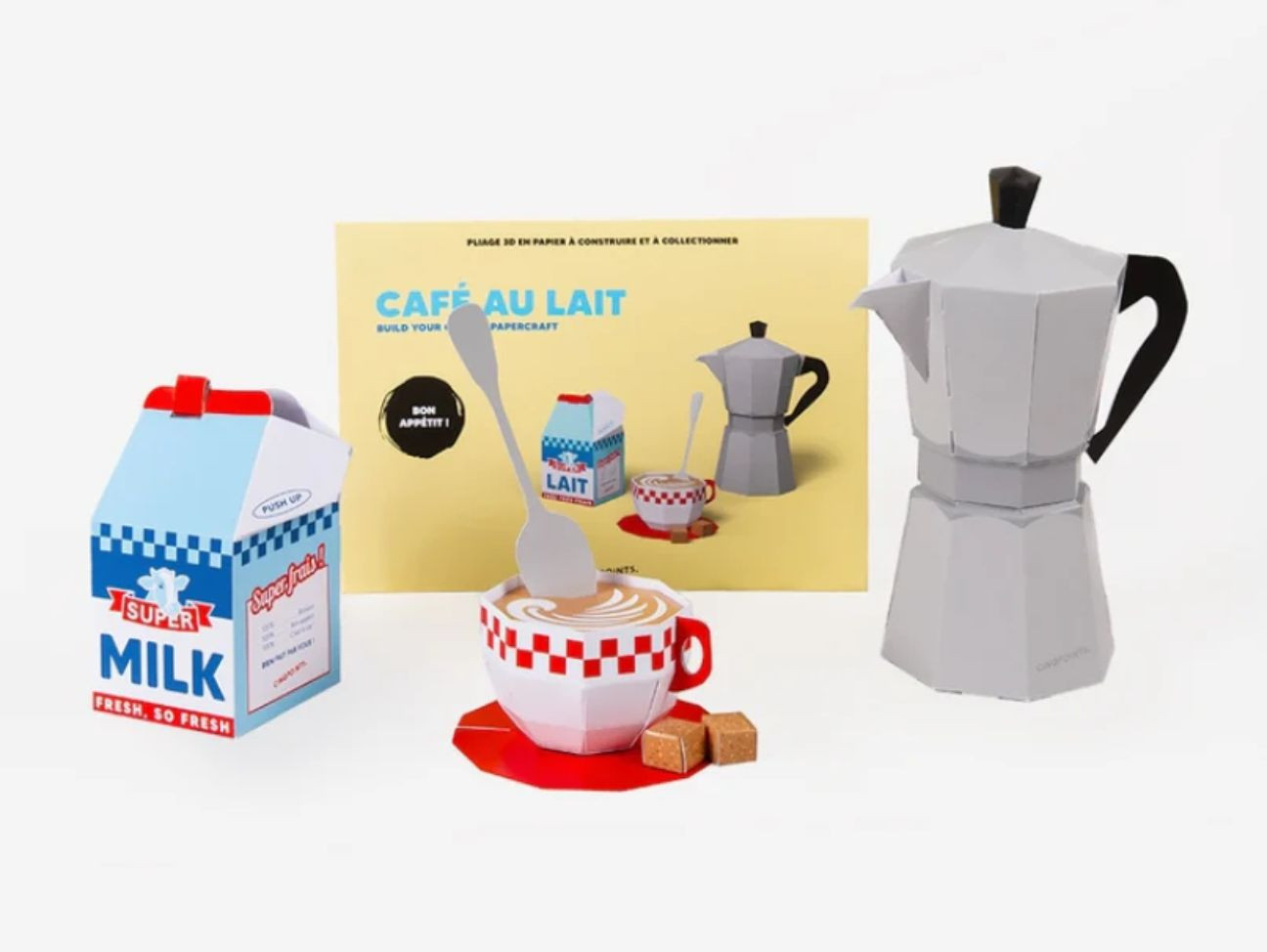Maquette en papier 3D à assembler soi-même, représentant une cafetière, une brique de lait, du sucre...